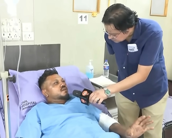 Man in hospital bed being interviewed about sole survivor of Air India crash performing a heartbreaking final act for brother.