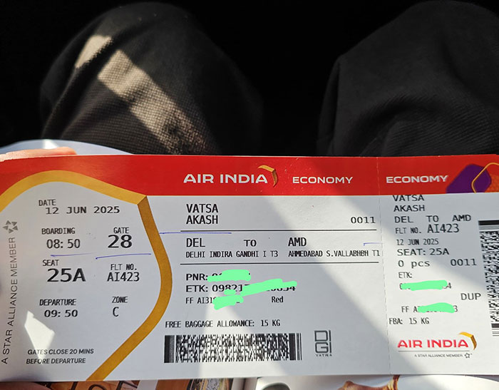 Air India boarding pass held by passenger exposing tech failures on Boeing jet before crash, showing flight details.
