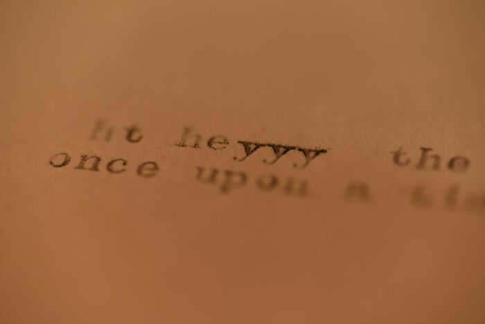 Close-up of blurred vintage typewriter text symbolizing famous paradoxes that challenge even smart people's understanding.