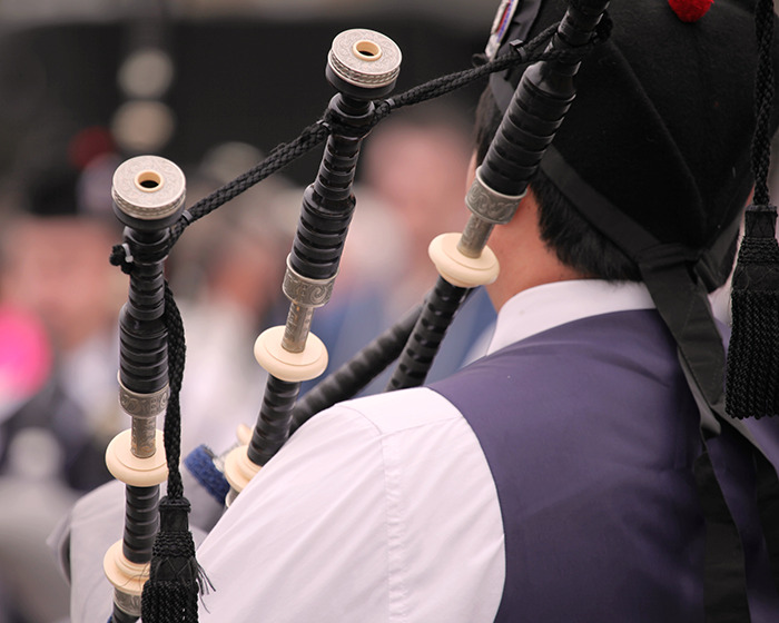 Person playing bagpipes outdoors, highlighting the bagpipe Karen incident involving a park confrontation.