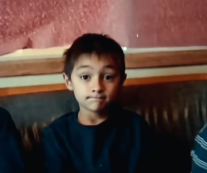 Young boy sitting on a couch speaking about the Balloon Boy family infamous controversy years later.