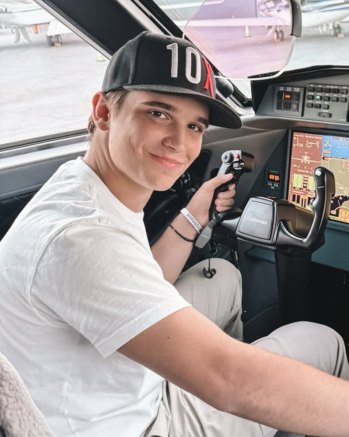 Young man in a cockpit holding joystick controls, related to Barron Trump and Khaby Lame detained by ICE claims. Young man in a cockpit holding joystick controls, related to Barron Trump and Khaby Lame detained by ICE claims.