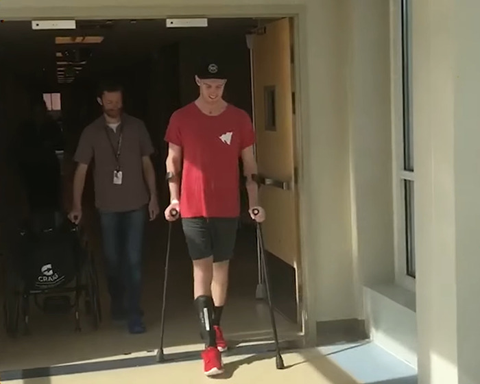 Young jiu-jitsu student on crutches after tragic freak accident during sparring with black-belt trainer.