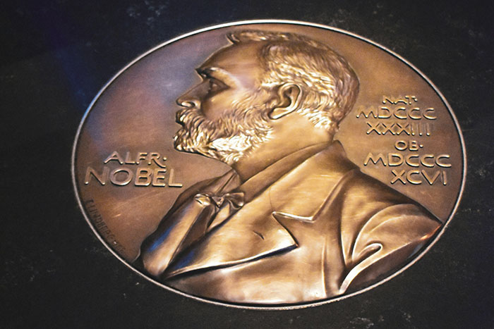 Close-up of a Nobel Prize medal featuring Alfred Nobel's profile, linked to discussions on the biggest scandal in human history.