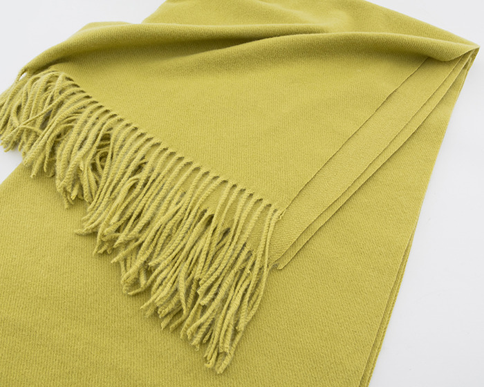 Yellow wool scarf with fringed edges folded neatly on a white surface related to viral scarf challenge safety.