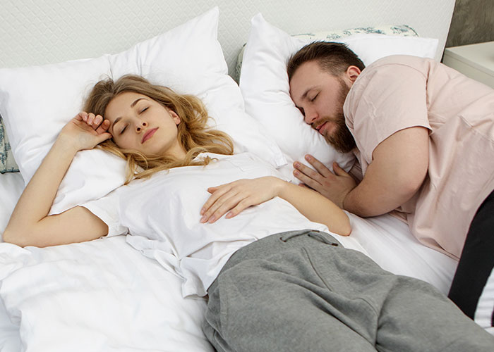 Upset woman and her friend&rsquo;s girlfriend conflict over not being allowed to sleep in the same bed, causing tension.