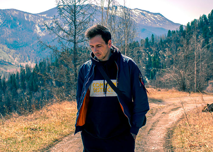 Man reflecting on nature trail during autumn, illustrating moments people broke guy or girl code for better choices.