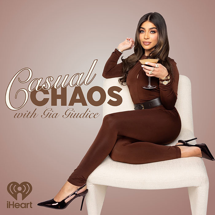 Woman in brown outfit sitting with a cocktail, representing casual chaos and pushy influencer rejection by Taylor Swift.