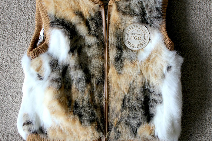 Fur vest with Australian brand label, showing mass fury over cat fur use despite wool claims on tags. Fur vest with Australian brand label, showing mass fury over cat fur use despite wool claims on tags.