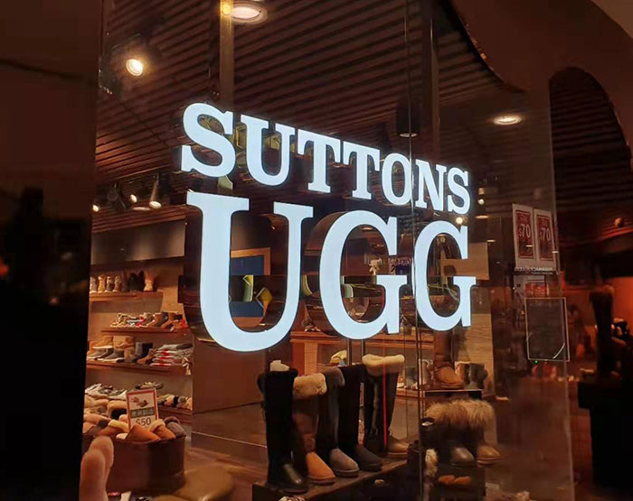 Fashion brand store window displaying boots, linked to mass fury over cat fur used despite wool labels controversy. Fashion brand store window displaying boots, linked to mass fury over cat fur used despite wool labels controversy.