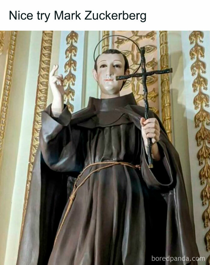 Statue of a saint holding a cross with humorous text, perfect for silly memes for classical art lovers.