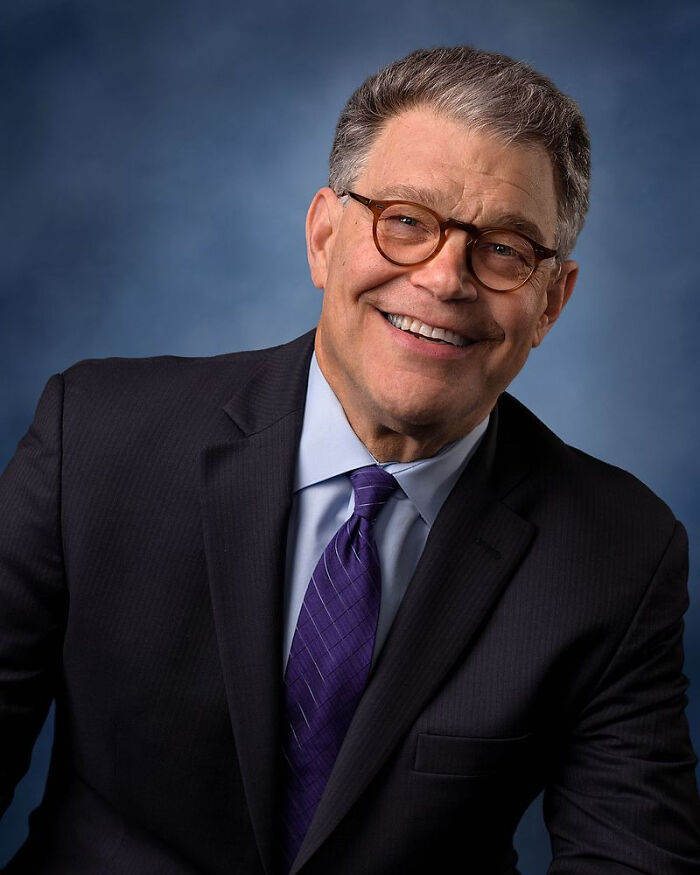 Smiling man in glasses and a dark suit, representing former Hollywood stars who pursued normal careers after the spotlight.