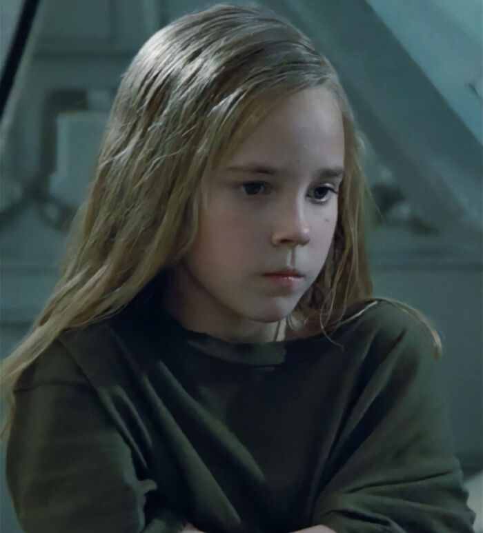 Young former Hollywood star with long blonde hair wearing a dark shirt, reflecting on life after leaving the spotlight.