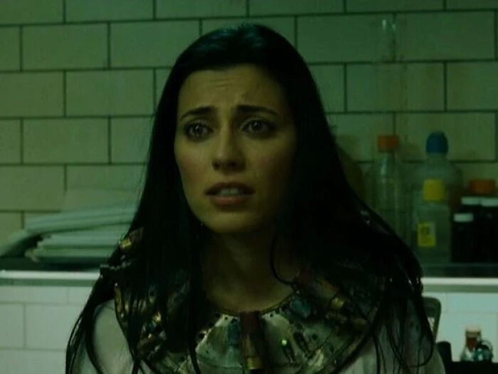 Woman with long dark hair wearing an Egyptian-style necklace, representing former Hollywood stars who left the spotlight for normal careers.