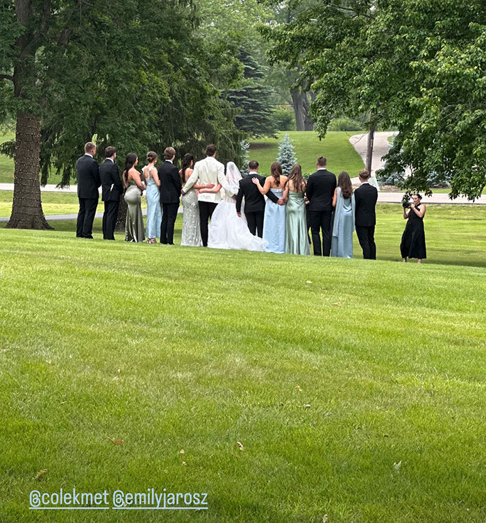 Group of people dressed for a wedding outdoors, possibly linked to Taylor Swift and Travis Kelce secret marriage rumors.