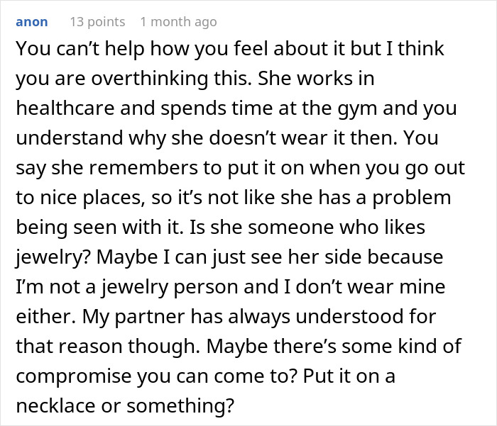 Comment discussing woman refusing to wear engagement ring and suggesting compromise like wearing it on a necklace. Comment discussing woman refusing to wear engagement ring and suggesting compromise like wearing it on a necklace.