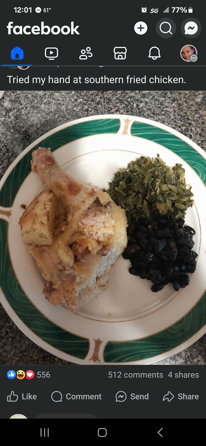 A plate of southern fried chicken with cooked greens, black beans, and cornbread on a green and white rimmed plate.