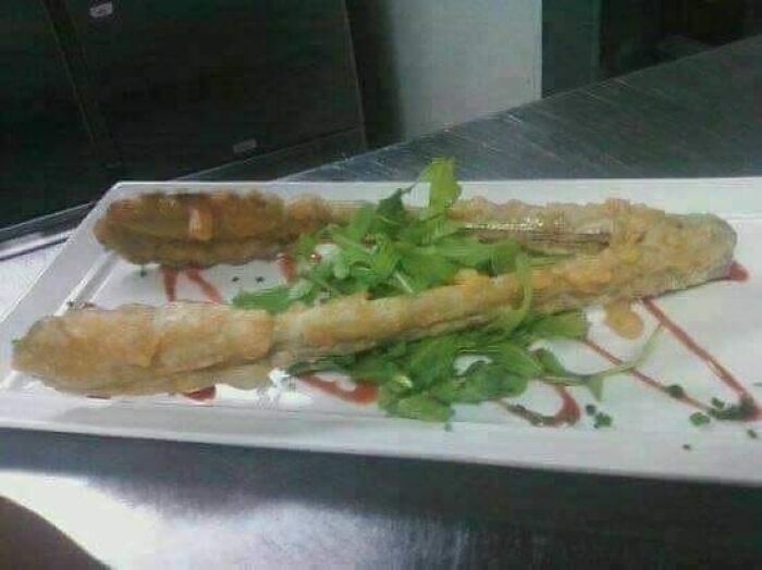 Deep-fried unusual foods served on a white plate with leafy greens, representing gross foods that might lose appetite.