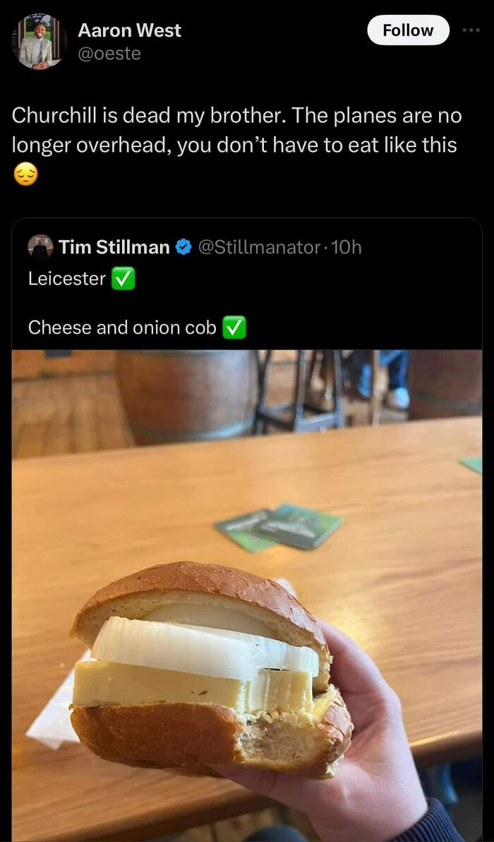 Hand holding a cheese and onion cob sandwich, an example of gross foods that might make you lose your appetite.