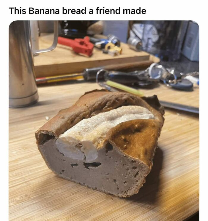 Banana bread with an unbaked banana inside on a wooden table, illustrating gross foods that might ruin your appetite.