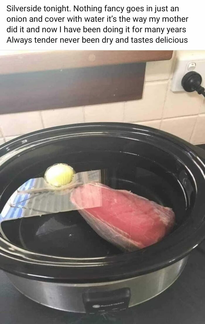 Raw meat and onion soaking in water inside a slow cooker, showcasing unusual preparation of gross foods.