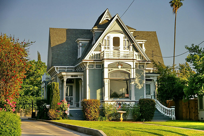 Victorian house with lush garden representing a man concerned about late girlfriend's mom suing for $100K legal advice.