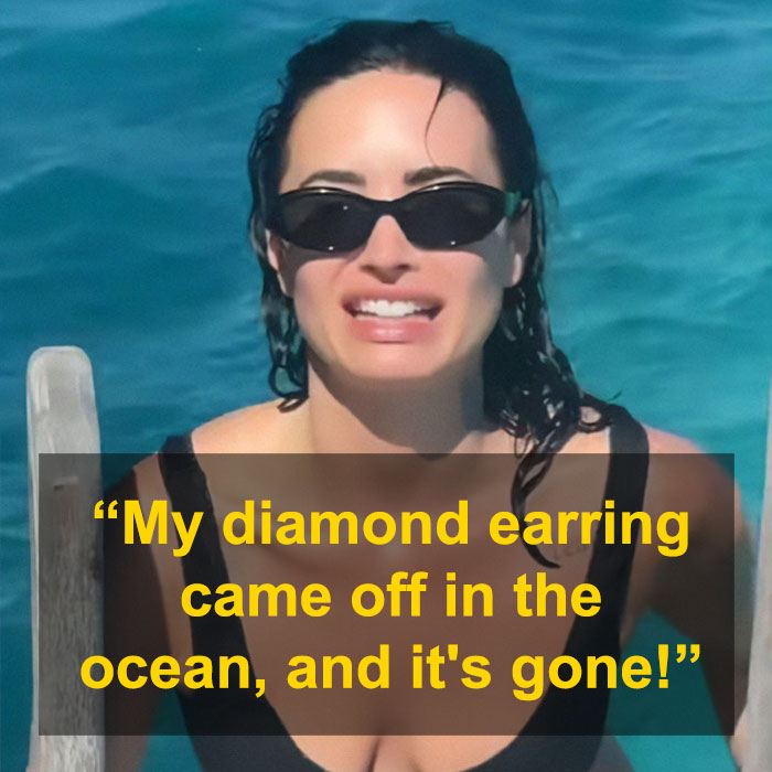Demi Lovato wearing sunglasses in ocean, speaking about lost diamond earring while showing off bikini-clad figure on honeymoon. Demi Lovato wearing sunglasses in ocean, speaking about lost diamond earring while showing off bikini-clad figure on honeymoon.
