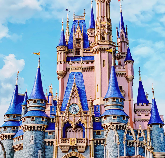 Disneyland castle with blue turrets under a bright sky, related to dad shocked by $1K breakfast bill at Disneyland. Disneyland castle with blue turrets under a bright sky, related to dad shocked by $1K breakfast bill at Disneyland.