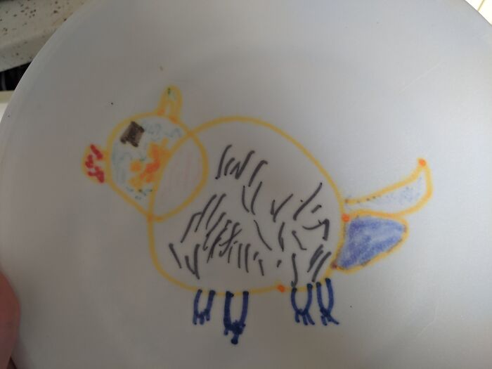 Child’s colorful and unhinged bird drawing showcasing creative freedom shared by art teachers online.