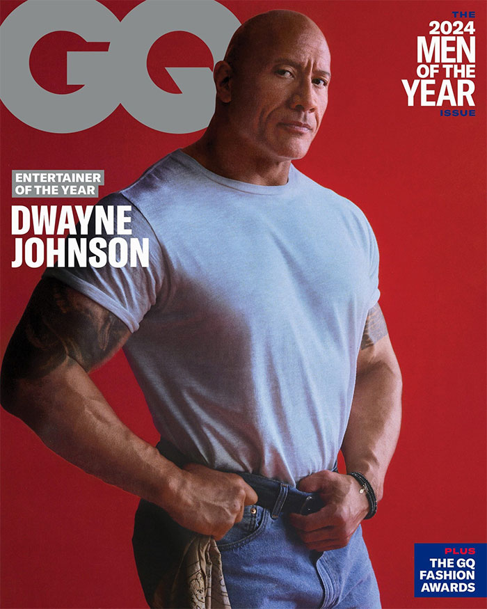 Dwayne Johnson posing confidently in a light blue shirt with focus on his net worth growth and success in 2025.