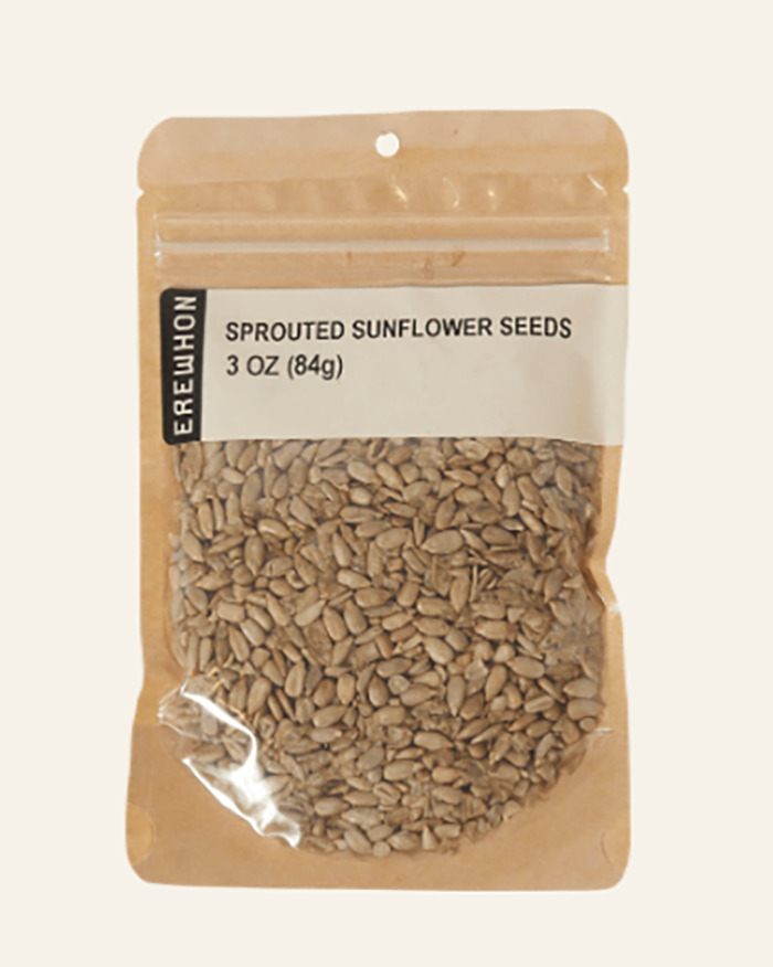 Brown resealable bag of sprouted sunflower seeds weighing 3 ounces with a clear window showing the seeds inside.