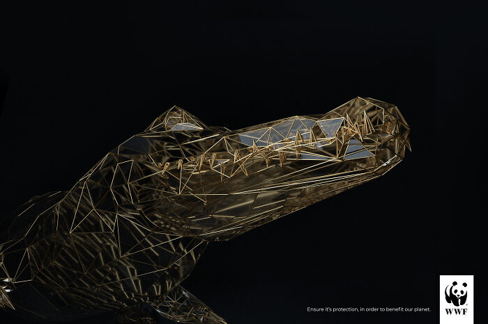 Abstract wireframe crocodile in dark background, a powerful WWF ad highlighting wildlife protection and conservation.