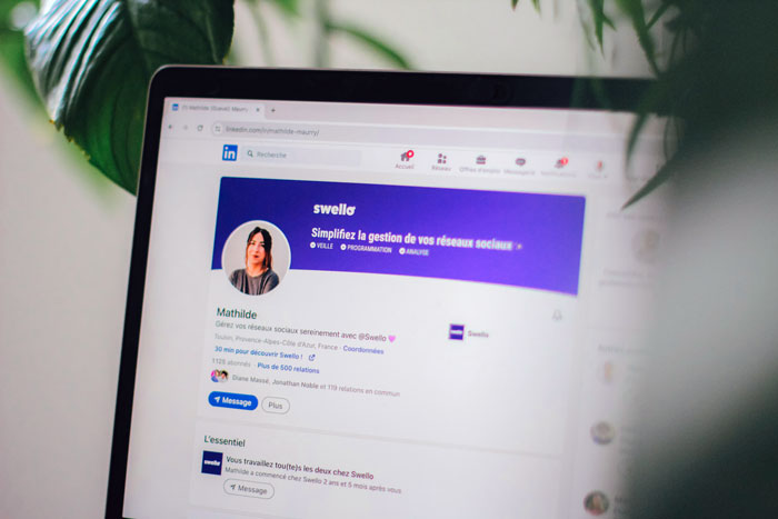LinkedIn profile page open on a laptop screen, featuring a user related to career advice and jobless worker topics.