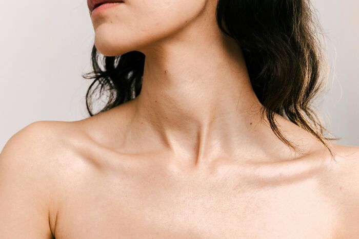 Close-up of a woman’s neck and shoulder area, representing postpartum OCD awareness and women's shared experiences.