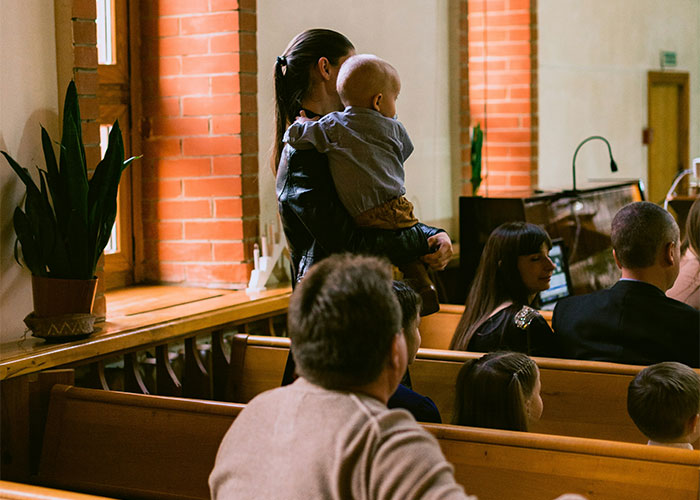 Parents and children sitting in a room, capturing moments of funny and inappropriate kids’ blurts shared by parents.