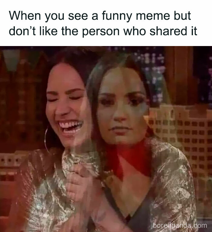 Woman experiencing mixed emotions laughing and serious, illustrating the funniest memes reaction to shared content.