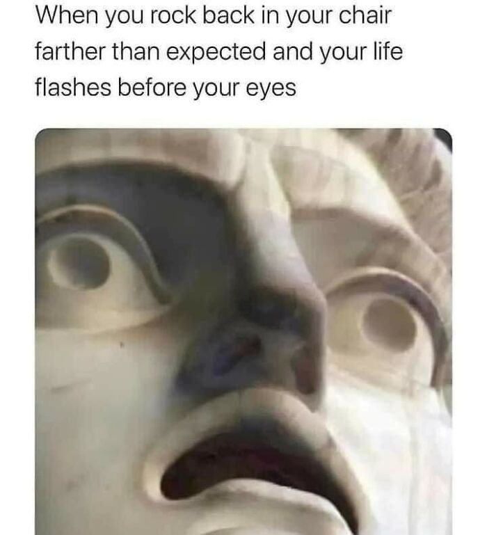 Close-up of a stone statue's shocked face paired with a funny meme about rocking too far back in your chair - funniest memes humor.