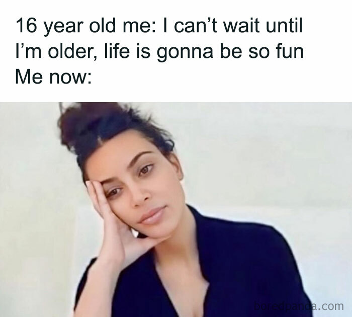 Woman with a tired expression resting her head on her hand, reflecting sarcastic memes about growing up and life realities.