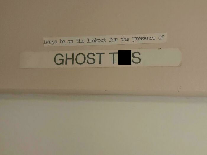 Sign on a wall saying always be on the lookout for the presence of ghost this, a funny pic showing confusion.