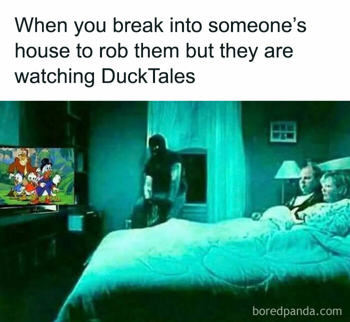 Humorous meme showing a burglar hesitating to rob a house because the victims are watching DuckTales on TV.