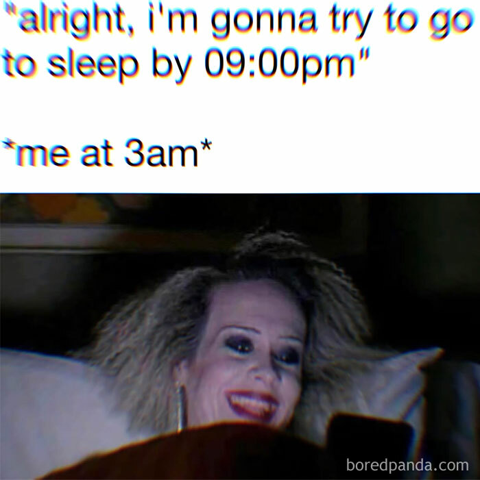 Woman with messy hair smiling at phone in bed at 3am, a relatable meme about introvert everyday life humor.