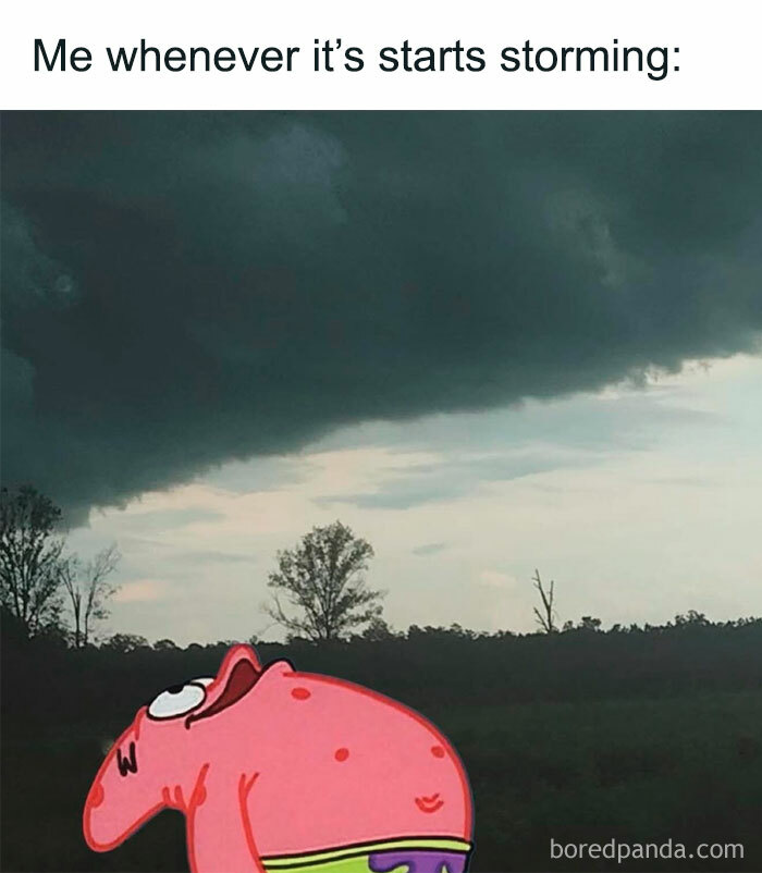 Pink cartoon character looking up at dark storm clouds, illustrating introvert everyday life in a humorous meme.