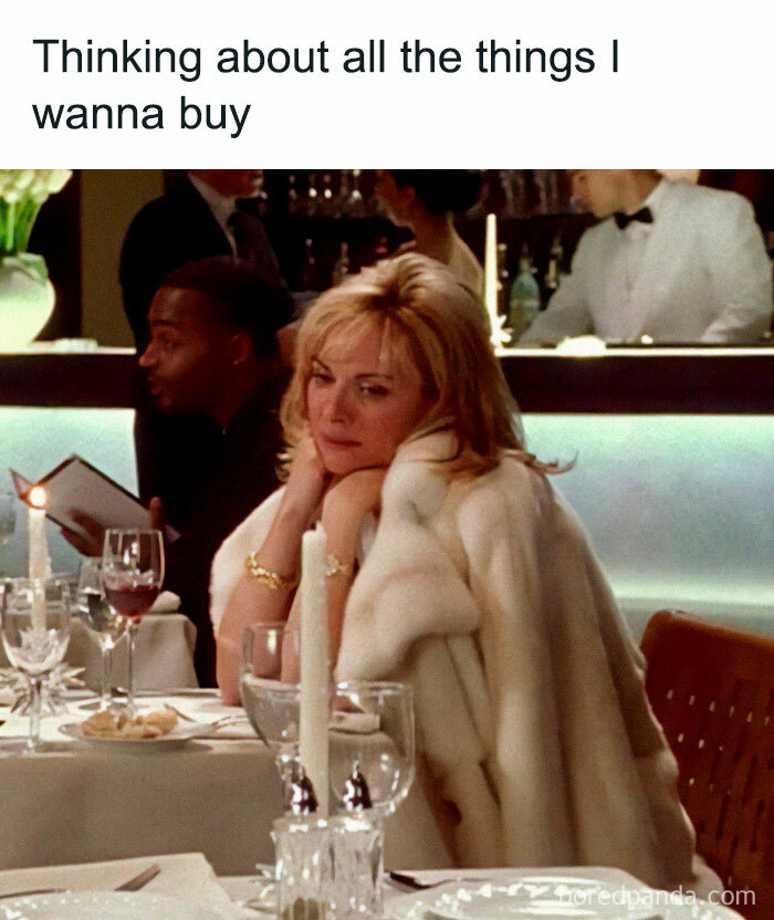 Woman in white fur coat sitting at a restaurant table, appearing thoughtful about things to buy in a circle of idiots meme.