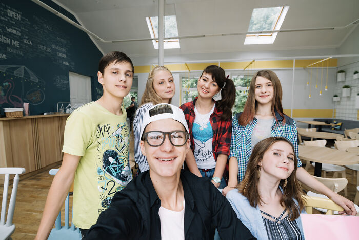 Group of teens in a classroom setting, illustrating younger generations and their nose-diving abilities shared by teachers