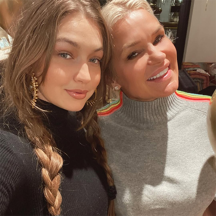 Gigi Hadid smiling with another woman, both indoors, highlighting the reaction to Khai's breakfast menu shared online. Gigi Hadid smiling with another woman, both indoors, highlighting the reaction to Khai's breakfast menu shared online.