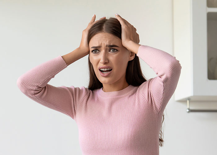 Woman upset and distressed after sister&rsquo;s friends drank her irreplaceable champagne, showing frustration and disbelief.