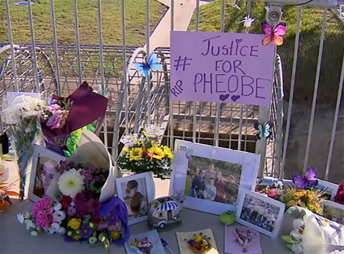 Memorial setup with flowers, photos, and justice for Pheobe sign at the funeral site of the teen mourner.