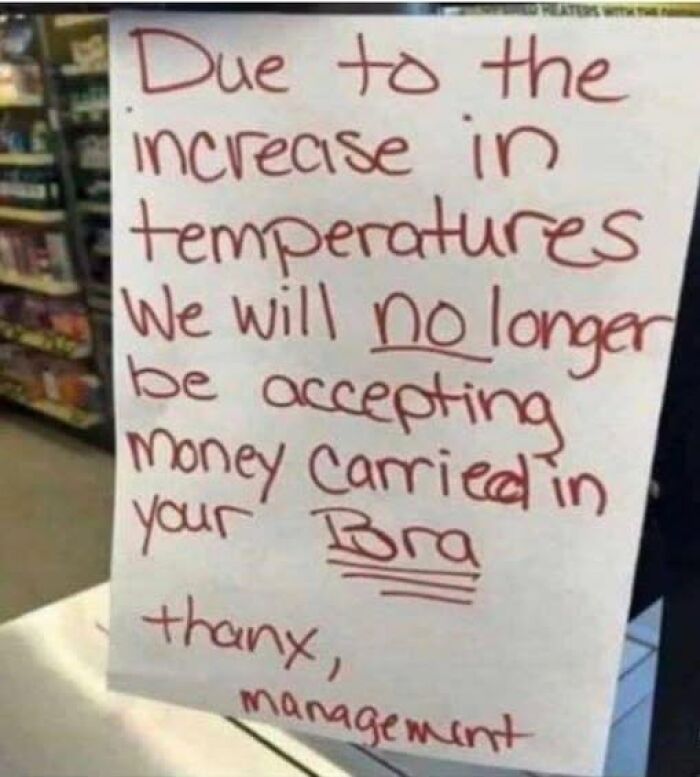 Handwritten humorous sign refusing money carried in bras due to temperature rise, adding chaos to everyday situations.