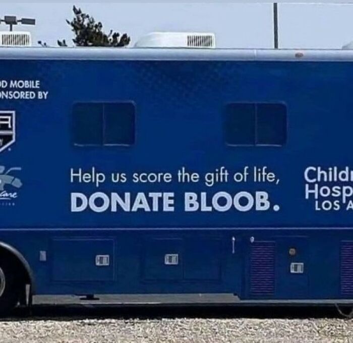 Blue blood donation mobile with funny sign saying donate bloob, adding hilarious chaos to the world.