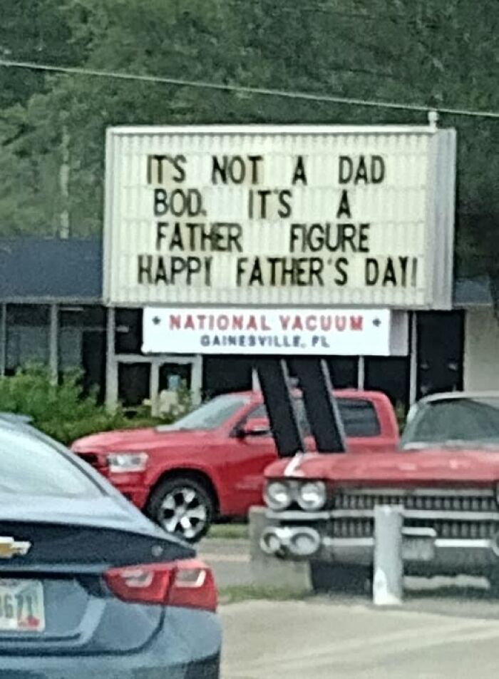 Funny roadside sign in Gainesville offering a chaotic twist on Father’s Day with a dad bod joke.